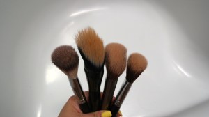 (L toR) Crown, Tweezerman, Urban Decay and Sigma